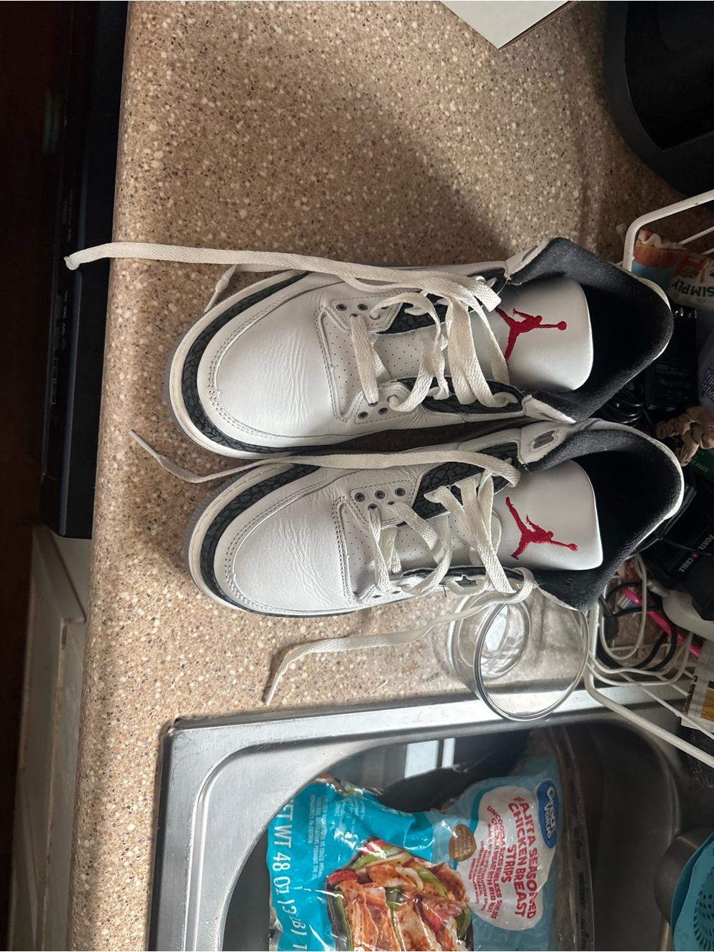Air Jordan 3 retros White and Black Sneakers with Red Jumpman.